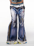 Distressed blue jeans with a white background
